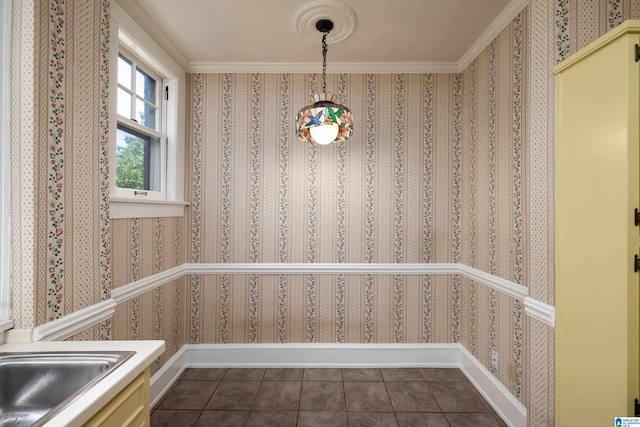 1479 Milner Cres S, Birmingham, AL 35205 - unfurnished dining area with dark tile patterned floors, wallpapered walls, crown molding, and a sink
