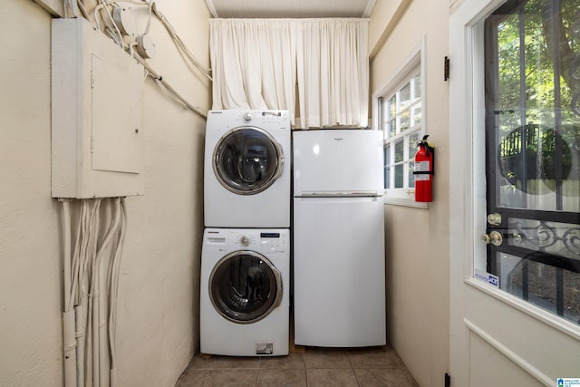 1479 Milner Cres S, Birmingham, AL 35205 - laundry area featuring stacked washing machine and dryer, tile patterned floors, and electric panel