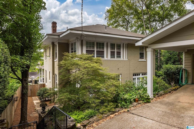 1479 Milner Cres S, Birmingham, AL 35205 - view of side of property featuring brick siding, a chimney, and fence