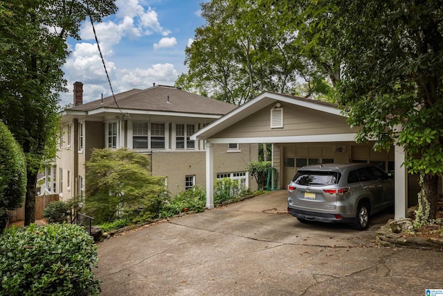 1479 Milner Cres S, Birmingham, AL 35205 - view of front of house with driveway, brick siding, a chimney, and a garage