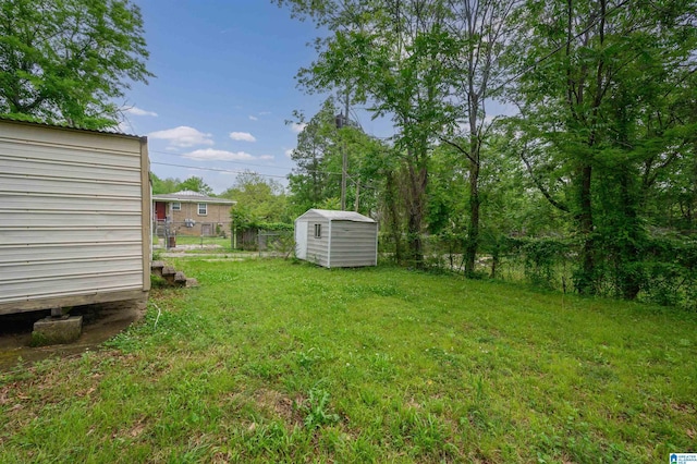view of yard featuring a shed and an outdoor structure