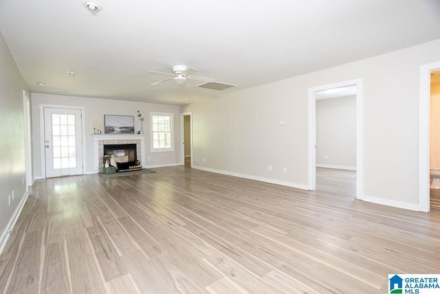 105 Mountain View Ln, Springville, AL 35146 - unfurnished living room featuring light wood-type flooring, a ceiling fan, and baseboards