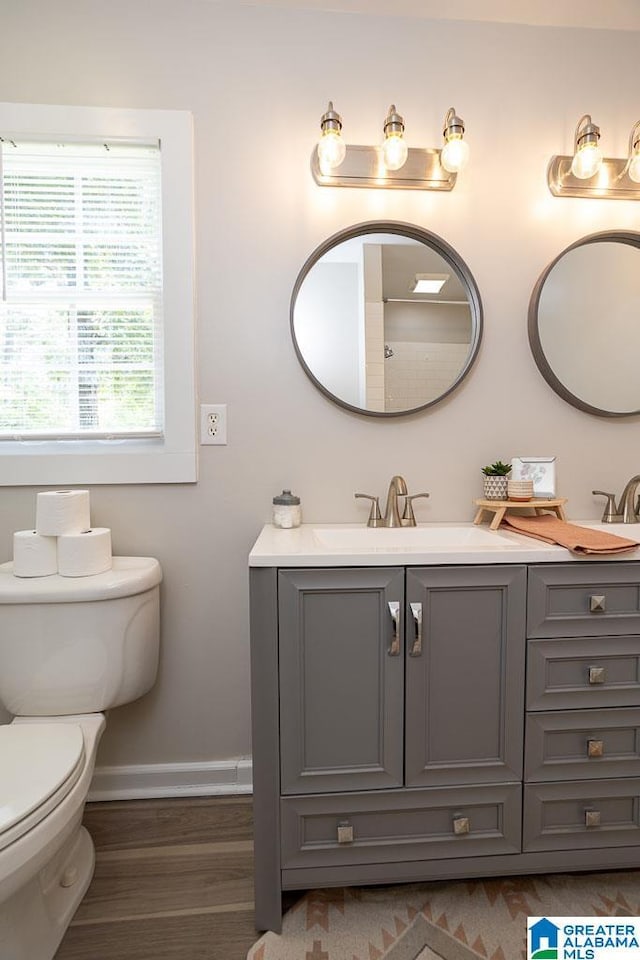 105 Mountain View Ln, Springville, AL 35146 - bathroom with vanity, wood finished floors, toilet, and baseboards
