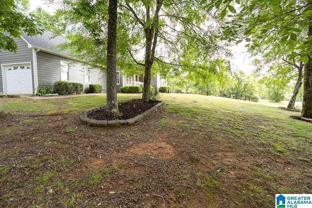 105 Mountain View Ln, Springville, AL 35146 - view of green lawn with a garage