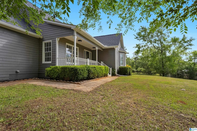 105 Mountain View Ln, Springville, AL 35146 - view of side of property featuring covered porch, a yard, and a shingled roof