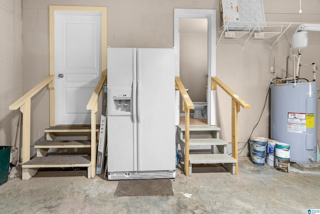 105 Mountain View Ln, Springville, AL 35146 - basement featuring white fridge with ice dispenser, electric water heater, and stairway