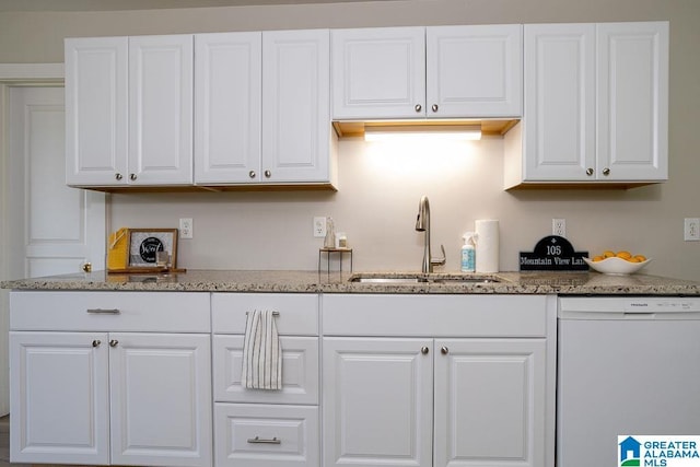 105 Mountain View Ln, Springville, AL 35146 - kitchen featuring a sink, white dishwasher, white cabinets, and light stone countertops