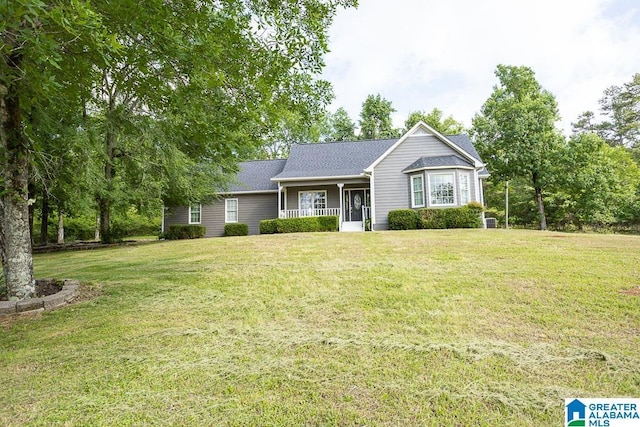 105 Mountain View Ln, Springville, AL 35146 - ranch-style home with a front lawn, covered porch, and a shingled roof