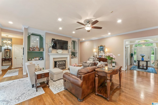 135 Weatherly Way, Pelham, AL 35124 - living area featuring light wood finished floors, ceiling fan, crown molding, recessed lighting, and a fireplace