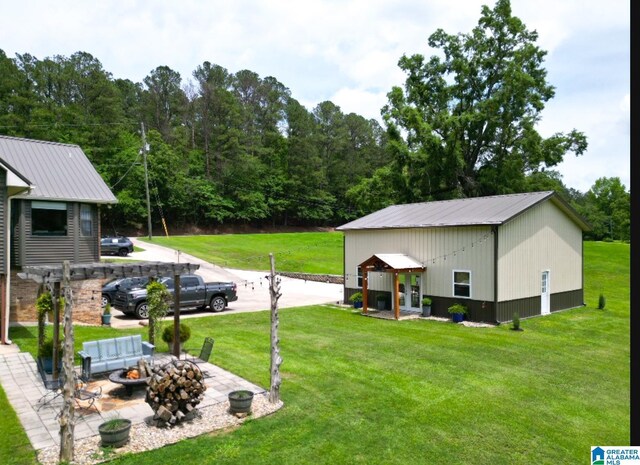 3455 Self Creek Rd, Warrior, AL 35180 - view of green lawn featuring a fire pit