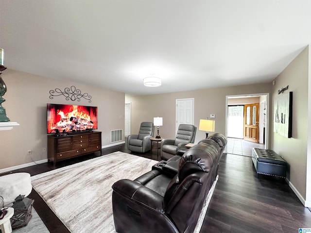 3455 Self Creek Rd, Warrior, AL 35180 - living area featuring dark wood-style floors and baseboards