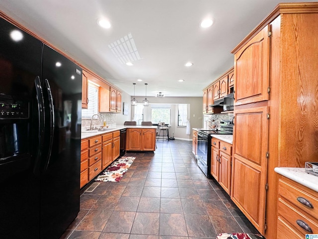 3455 Self Creek Rd, Warrior, AL 35180 - kitchen with black appliances, a peninsula, decorative backsplash, recessed lighting, and light countertops