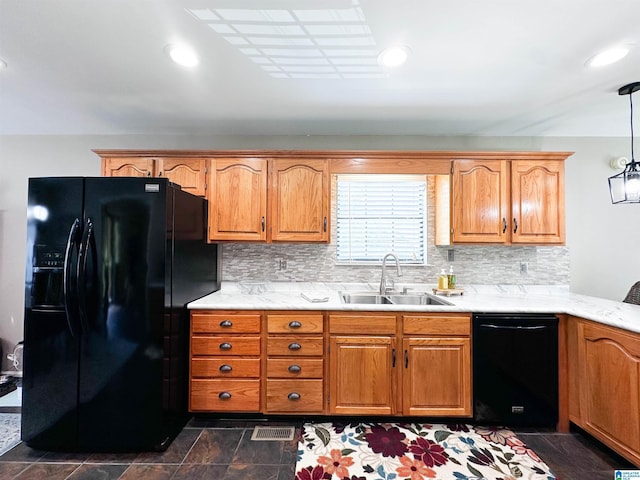 3455 Self Creek Rd, Warrior, AL 35180 - kitchen with black appliances, a sink, decorative backsplash, hanging light fixtures, and brown cabinets
