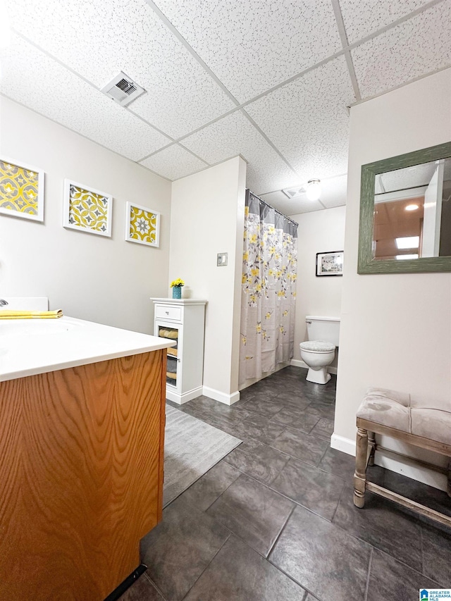 3455 Self Creek Rd, Warrior, AL 35180 - bathroom with a drop ceiling, vanity, toilet, baseboards, and a shower with curtain