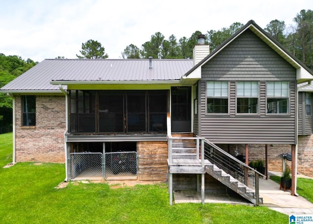 3455 Self Creek Rd, Warrior, AL 35180 - back of house featuring a sunroom, a chimney, and a yard