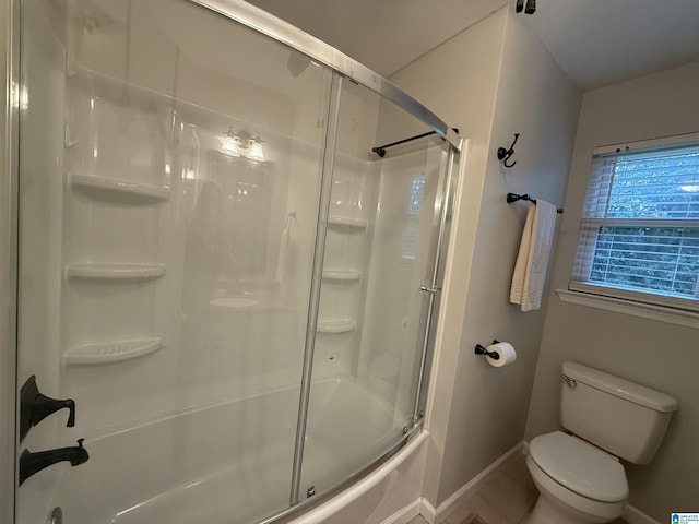 1118 Eagle Dr, Maylene, AL 35114 - full bathroom featuring baseboards, toilet, combined bath / shower with glass door, and tile patterned flooring