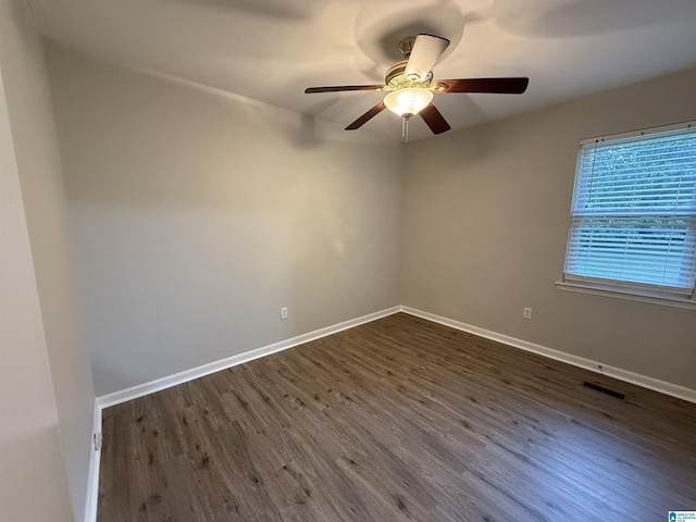 1118 Eagle Dr, Maylene, AL 35114 - unfurnished room featuring dark wood-type flooring, ceiling fan, and baseboards