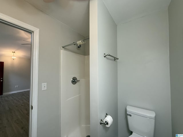 1118 Eagle Dr, Maylene, AL 35114 - bathroom with a shower, toilet, and wood finished floors