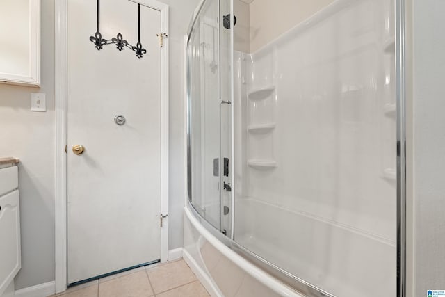 1118 Eagle Dr, Maylene, AL 35114 - full bathroom featuring tile patterned floors, combined bath / shower with glass door, and baseboards