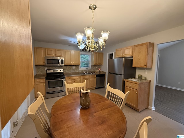 1118 Eagle Dr, Maylene, AL 35114 - kitchen featuring stainless steel appliances, a chandelier, backsplash, a sink, and light brown cabinets