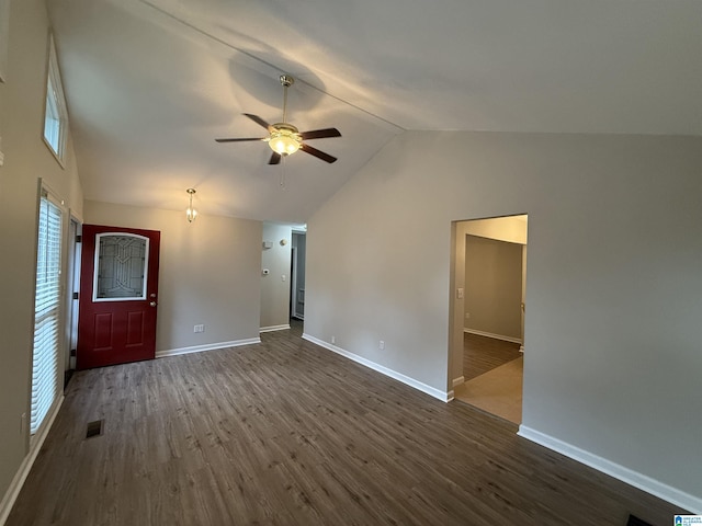 1118 Eagle Dr, Maylene, AL 35114 - unfurnished living room featuring dark wood-type flooring, lofted ceiling, baseboards, and ceiling fan
