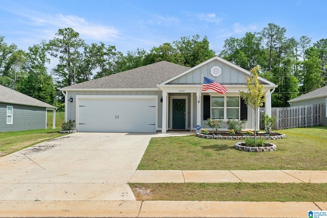 204 Koslin Loop, Calera, AL 35040 - view of front of house with board and batten siding, a garage, driveway, and roof with shingles