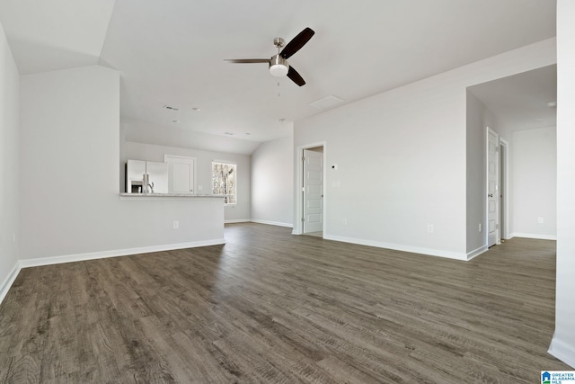 unfurnished living room featuring dark wood finished floors, a ceiling fan, and baseboards