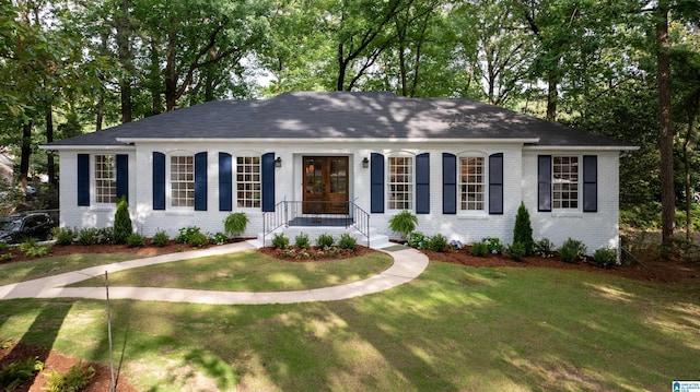 3317 Overton Rd, Mountain Brook, AL 35223 - single story home featuring brick siding, a front lawn, and view of wooded area