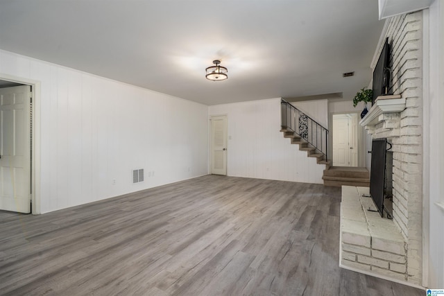3317 Overton Rd, Mountain Brook, AL 35223 - unfurnished living room with a fireplace, wood finished floors, and stairs