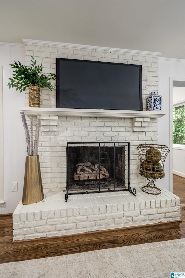 3317 Overton Rd, Mountain Brook, AL 35223 - detailed view of wood finished floors, a brick fireplace, and ornamental molding