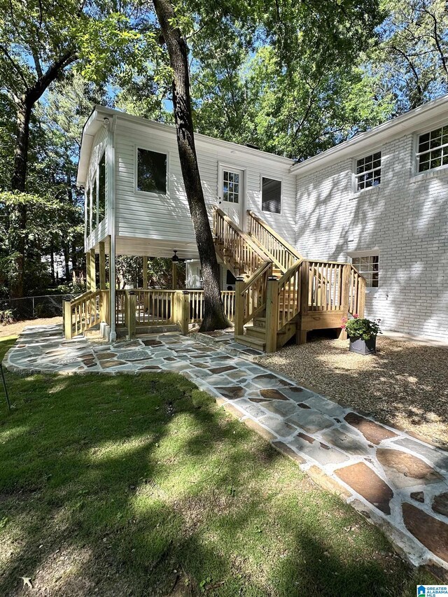 3317 Overton Rd, Mountain Brook, AL 35223 - back of property with stairway, a lawn, and a patio