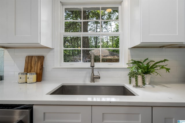 3317 Overton Rd, Mountain Brook, AL 35223 - kitchen featuring a sink, white cabinets, backsplash, and light stone countertops
