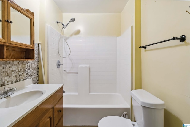 bathroom with toilet, tasteful backsplash, vanity, and shower / tub combination