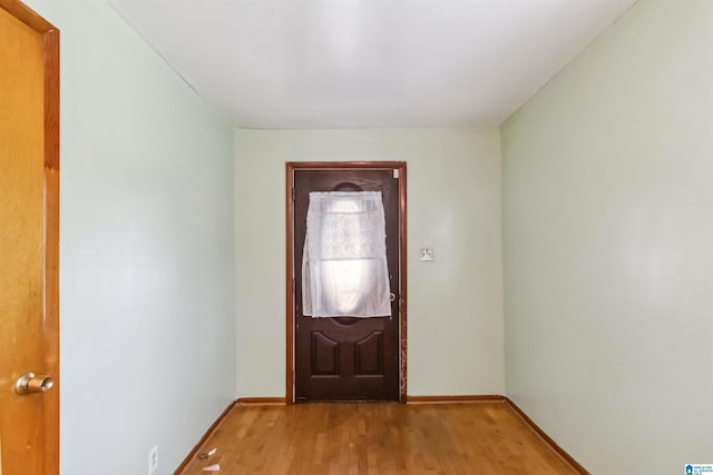 entryway with light wood-style floors and baseboards