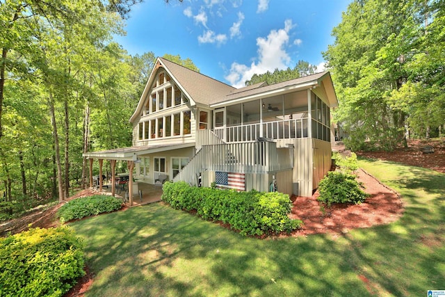 2974 Crescent Crest Dr, Wedowee, AL 36278 - view of front of home featuring a sunroom, a patio area, a front lawn, stairway, and ceiling fan