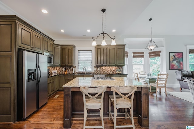 5226 Mountain Ridge Parkway, Birmingham, AL 35222 - kitchen with stainless steel appliances, a sink, light stone countertops, tasteful backsplash, and dark wood finished floors