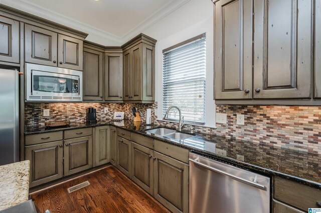 5226 Mountain Ridge Parkway, Birmingham, AL 35222 - kitchen featuring stainless steel appliances, a sink, tasteful backsplash, and crown molding