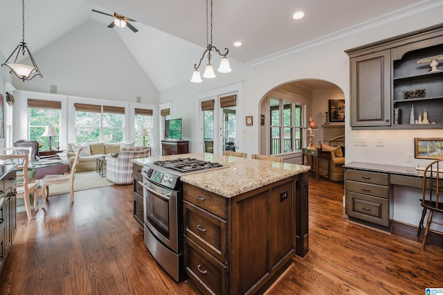 5226 Mountain Ridge Parkway, Birmingham, AL 35222 - kitchen featuring stainless steel range with gas stovetop, open floor plan, high vaulted ceiling, open shelves, and arched walkways