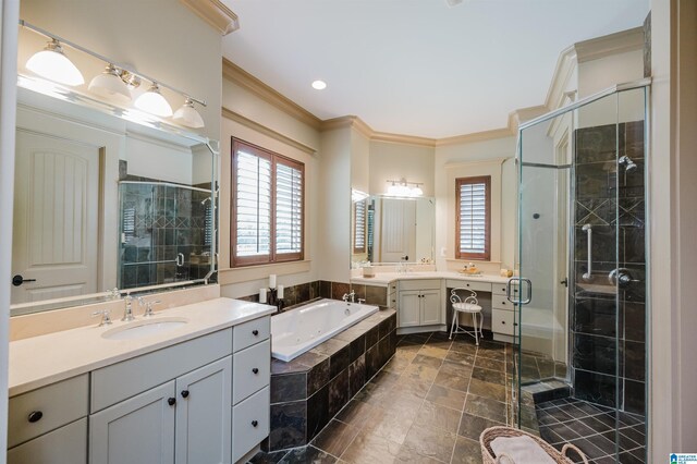 5226 Mountain Ridge Parkway, Birmingham, AL 35222 - bathroom featuring crown molding, a stall shower, a bath, and two vanities