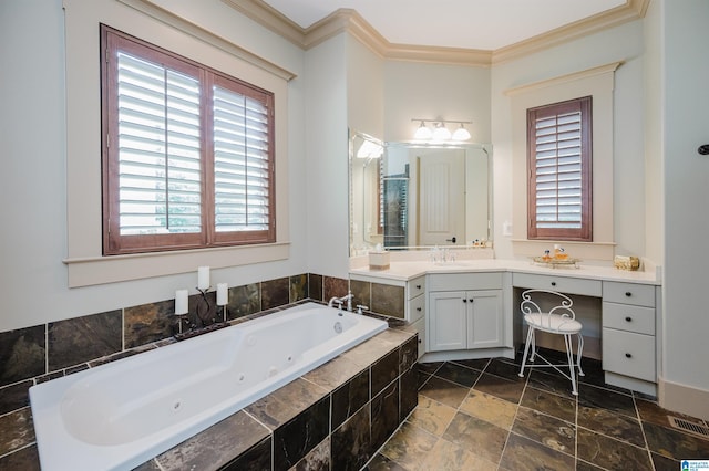 5226 Mountain Ridge Parkway, Birmingham, AL 35222 - full bathroom with ornamental molding, healthy amount of natural light, a tub with jets, vanity, and stone finish floors