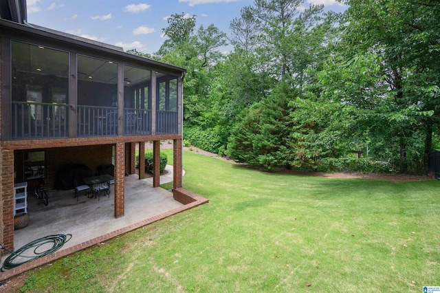 5226 Mountain Ridge Parkway, Birmingham, AL 35222 - view of grassy yard featuring a patio area and a sunroom