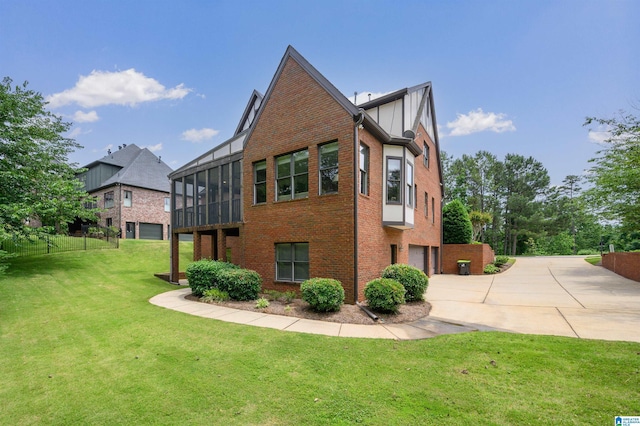 5226 Mountain Ridge Parkway, Birmingham, AL 35222 - view of side of home featuring concrete driveway, a garage, brick siding, and a sunroom