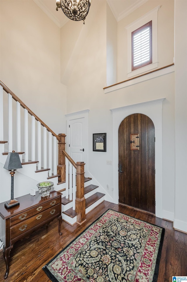5226 Mountain Ridge Parkway, Birmingham, AL 35222 - entryway with ornamental molding, arched walkways, wood finished floors, stairway, and a towering ceiling