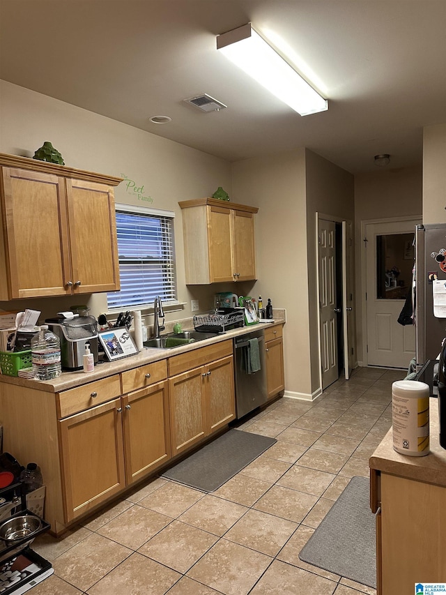 4117 Jubilee Ln, Moody, AL 35004 - kitchen with a sink, stainless steel appliances, light countertops, light tile patterned flooring, and light brown cabinets