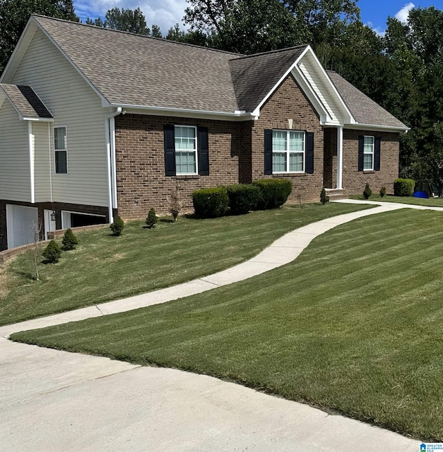 180 Thornberry Dr, Hayden, AL 35079 - single story home with brick siding, roof with shingles, a front yard, and an attached garage