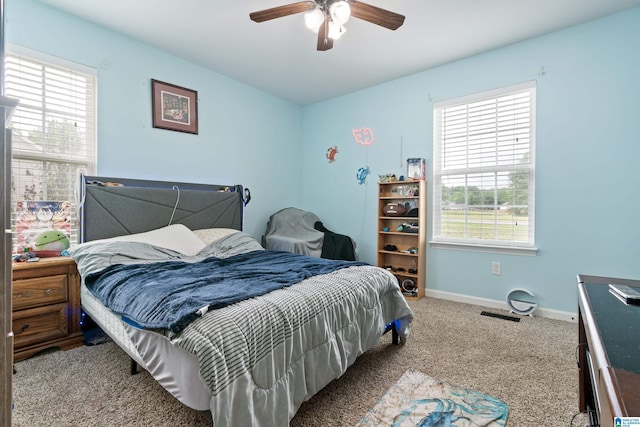180 Thornberry Dr, Hayden, AL 35079 - bedroom with multiple windows, carpet floors, baseboards, and ceiling fan