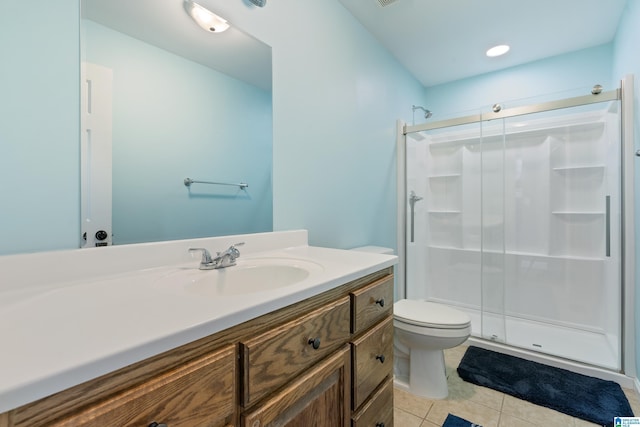 180 Thornberry Dr, Hayden, AL 35079 - bathroom with vanity, toilet, a shower stall, and tile patterned flooring