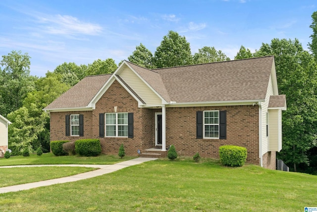 180 Thornberry Dr, Hayden, AL 35079 - view of front of house featuring brick siding, a front lawn, and a shingled roof