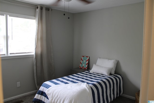 1140 Tribe Trl, Alabaster, AL 35007 - carpeted bedroom with multiple windows, baseboards, and a ceiling fan