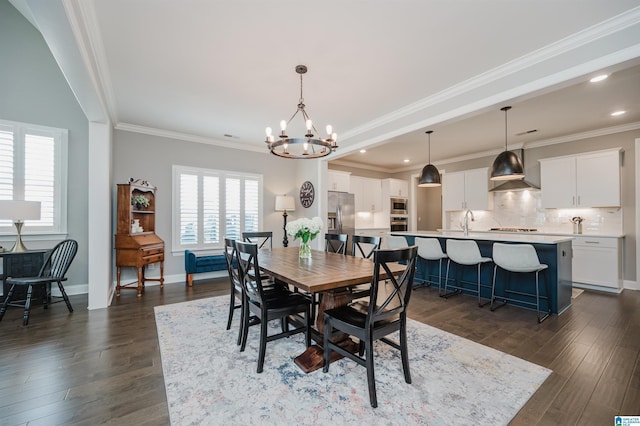 3104 Simms Lndg, Pelham, AL 35124 - dining area featuring a chandelier, dark wood-type flooring, crown molding, recessed lighting, and baseboards